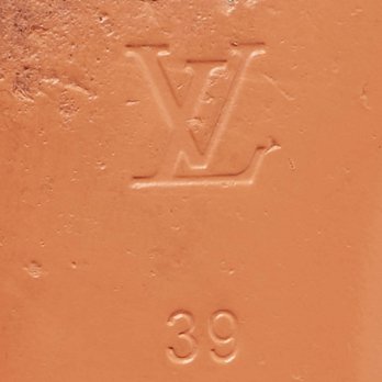 Orange Monogram Embossed Leather Revival Flat Slides